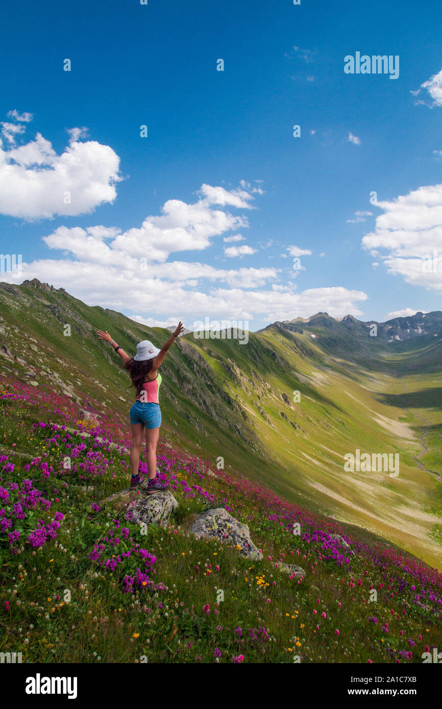 as the girl Nature Explorer gazes towards the mountains Stock Photo - Alamy