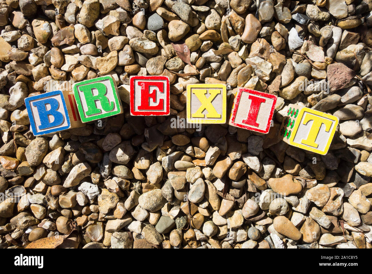 Brexit children's alphabet blocks on a background of pebbles Stock Photo
