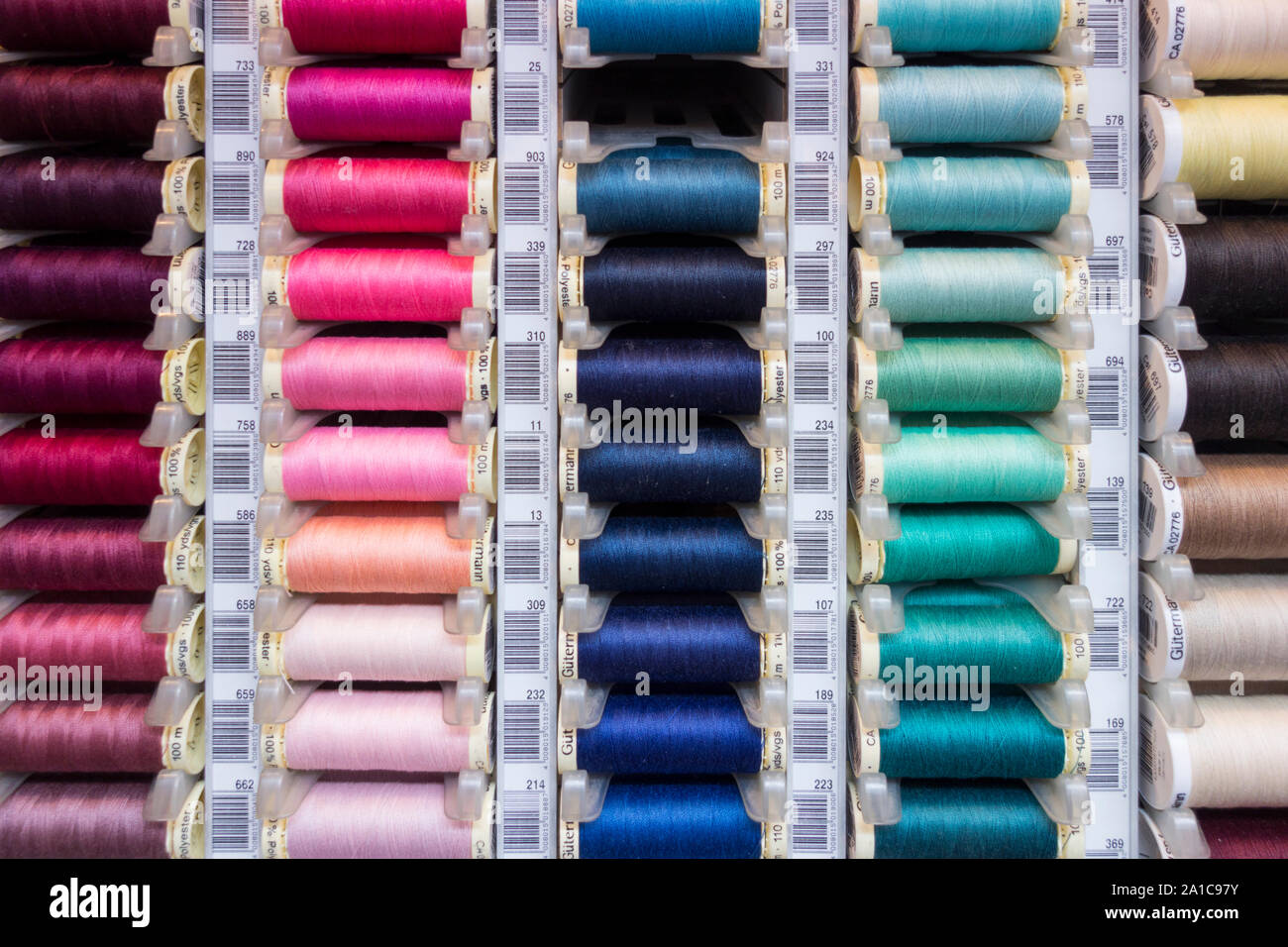 Closeup of colourful cotton reels for sewing machines Stock Photo