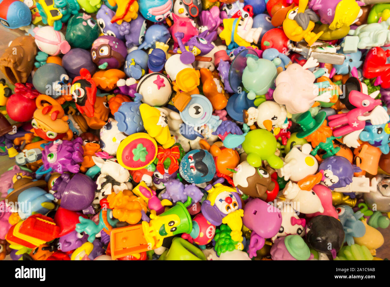 A pile of colourful children's plastic toys Stock Photo Alamy