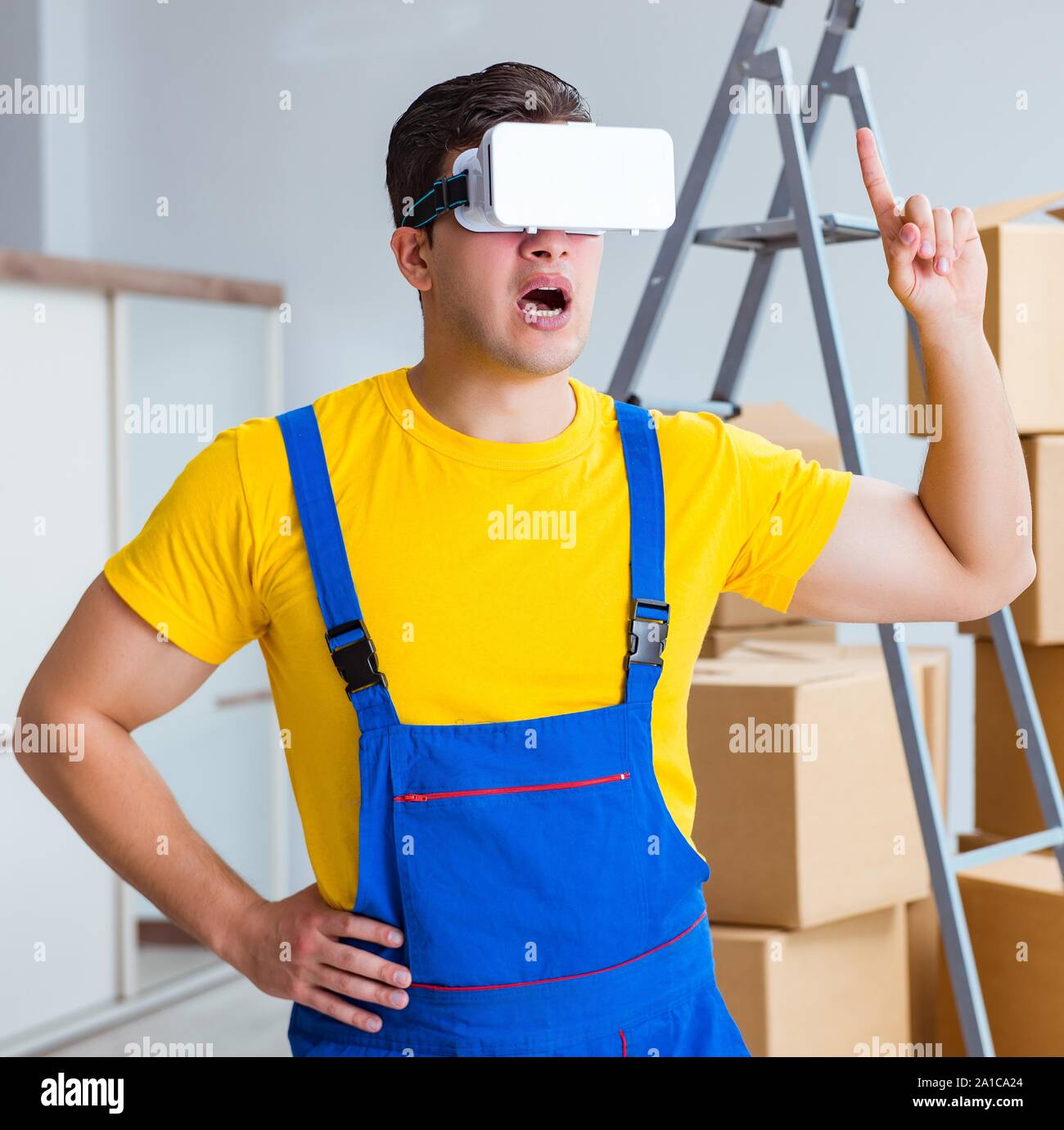 The painter contractor working with virtual reality goggles Stock Photo