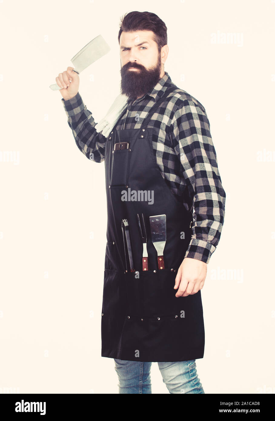 Perfect for precise cutting. Brutal cook holding butcher axe. Butcher