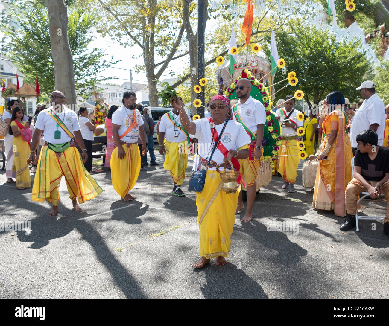 A float with a statue of Vinayagar, more commonly called Ganesh, is escorted into Smokey Park at the conclusion of the Madrassi Parade for unity. NYC. Stock Photo