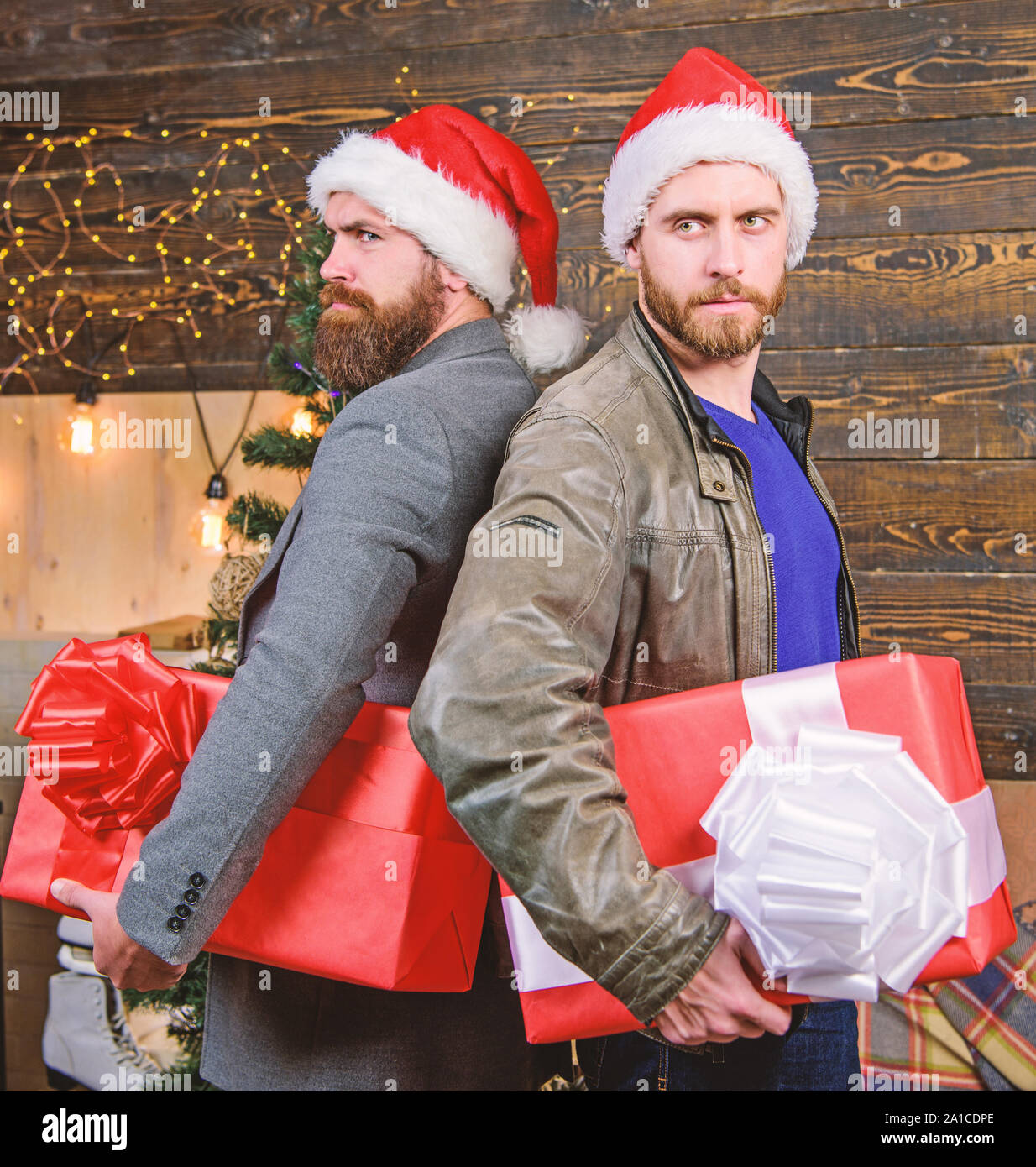 Men Wear Santa Hat Hold Gift Boxes Bearded Men Carry Present Boxes Delivery Christmas Present Christmas Is Coming Brutal Hipster Guys Celebrate Christmas With Gifts Get Ready For Christmas Stock Photo