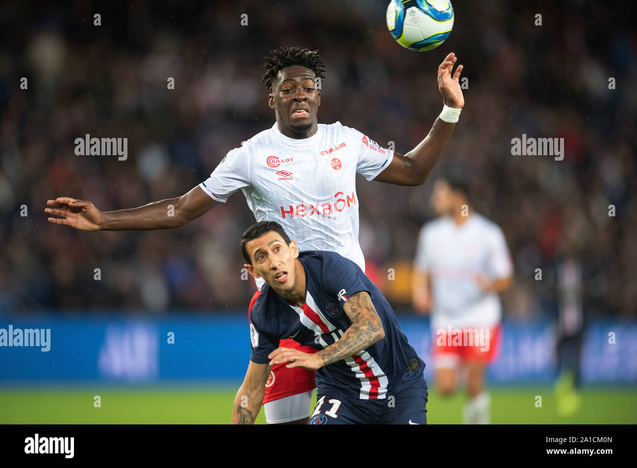 Paris. 25th Sep, 2019. Angel Di Maria (front) of Paris Saint-Germain competes with Axel Disasi of Reims during their 2019-2020 season French Ligue 1 match in Paris, France on Sept. 25, 2019. Credit: Jack Chan/Xinhua/Alamy Live News Stock Photo