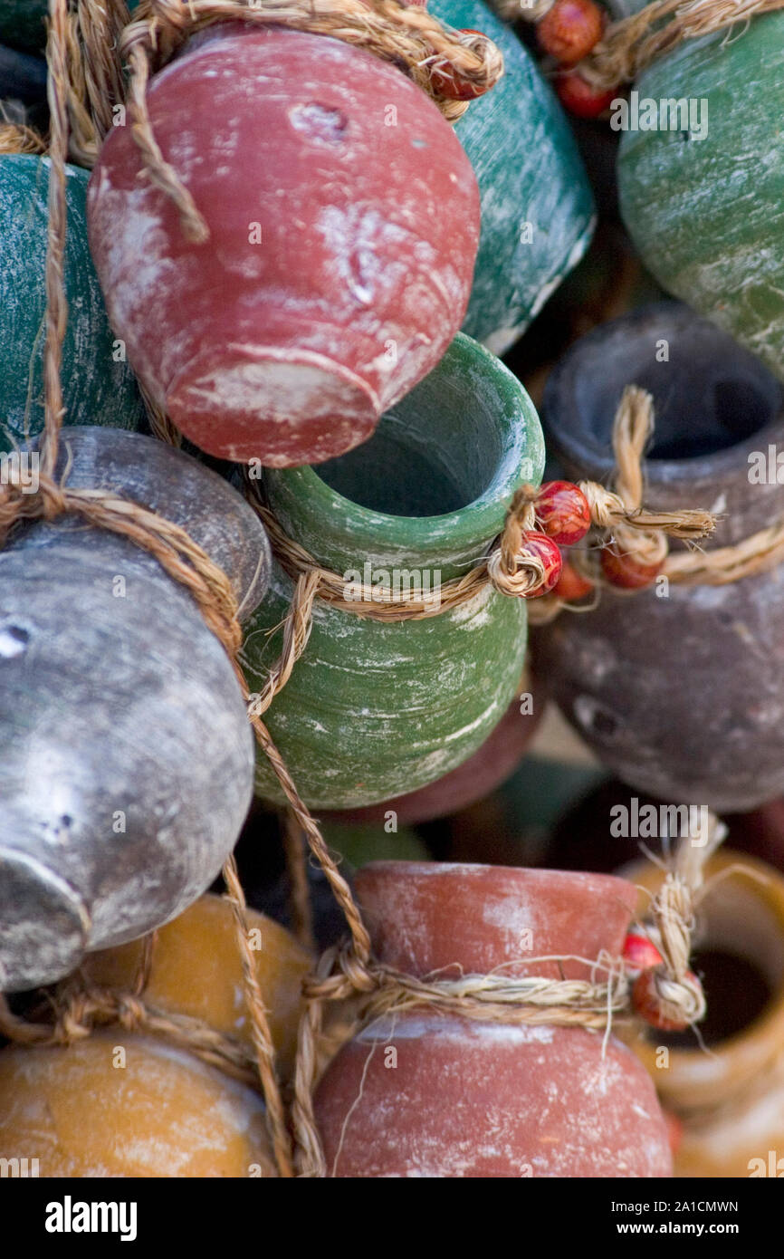 Miniature handmade pottery pots hanging in a street stall in San Diego, California Stock Photo