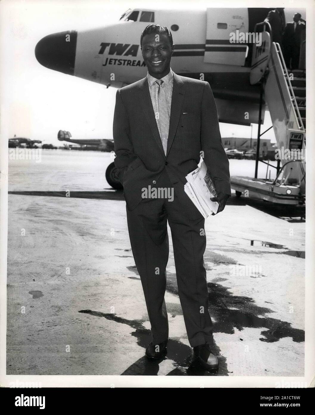 Aug 29, 1968 - New York, New York, USA - Singing Star NAT KING COLE stands on the tarmac at Idlewild Airport before boarding a TWA Ambassador Flight For Los Angeles. He will do TV shows and appear in the movie ''The St. Lous Blues,''.  (Credit Image: © Keystone Pictures USA/ZUMAPRESS.com) Stock Photo
