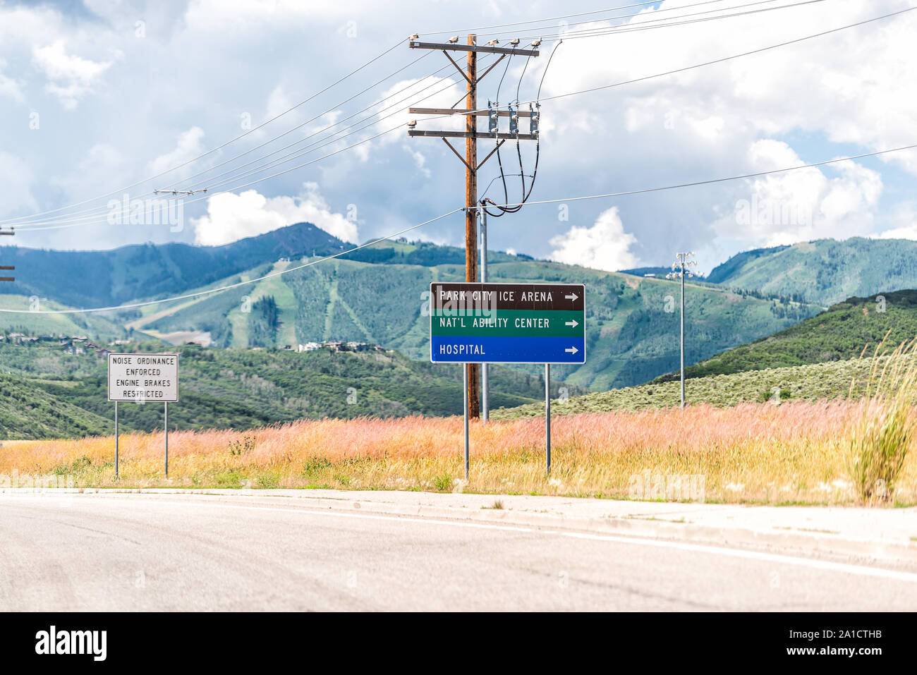 Wanship, USA - July 25, 2019: Park City area on interstate 80 highway or 189 with road signs for ice arena and mountain view Stock Photo