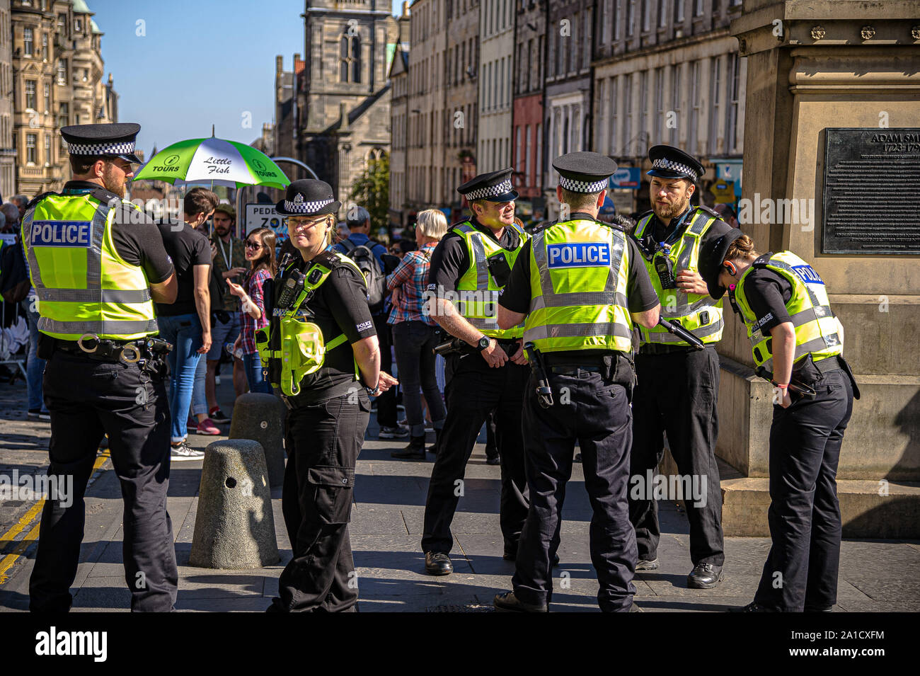 Police officers stand on guard during the protest.Organized by European Movement in Scotland as well as Edinburgh For Europe, protesters took to the streets of Edinburgh to demand MPs revoke Article 50 to prevent a no-deal and that the EU shares a notion to combat climate change. Stock Photo