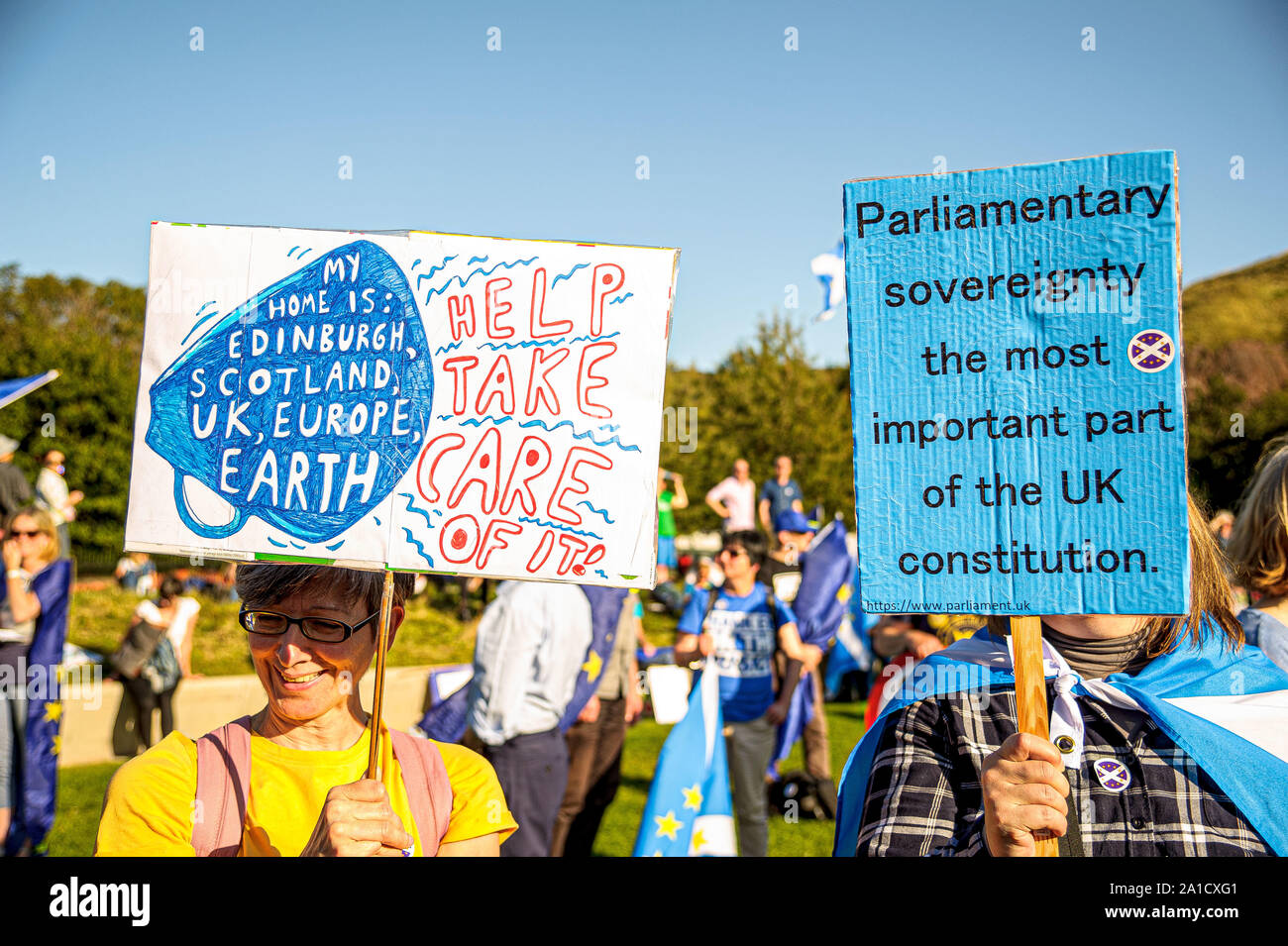 Protesters holding placards during the demonstration outside Scottish Parliament.Organized by European Movement in Scotland as well as Edinburgh For Europe, protesters took to the streets of Edinburgh to demand MPs revoke Article 50 to prevent a no-deal and that the EU shares a notion to combat climate change. Stock Photo