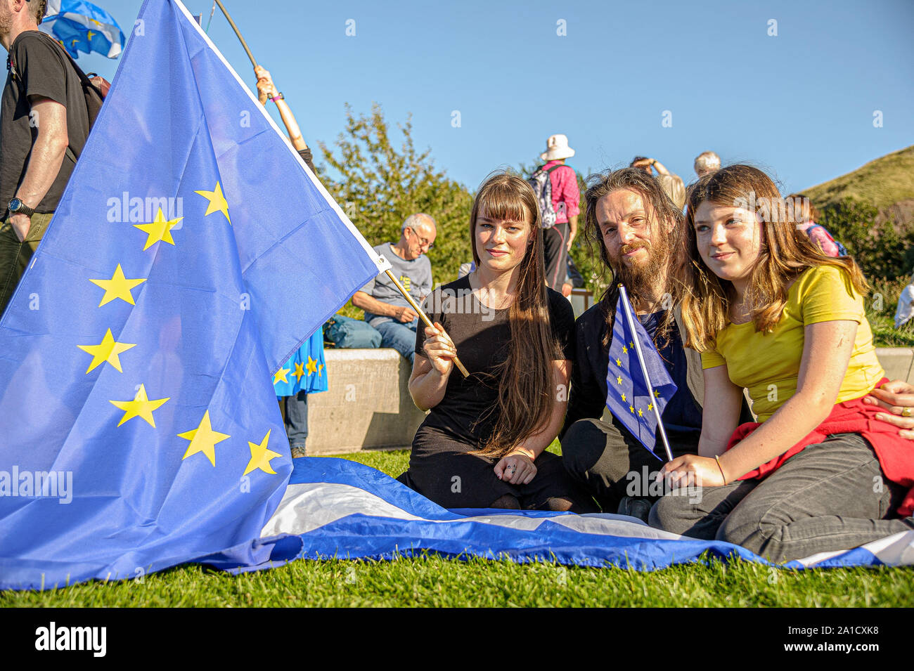A family holding EU flags during the protest.Organized by European Movement in Scotland as well as Edinburgh For Europe, protesters took to the streets of Edinburgh to demand MPs revoke Article 50 to prevent a no-deal and that the EU shares a notion to combat climate change. Stock Photo