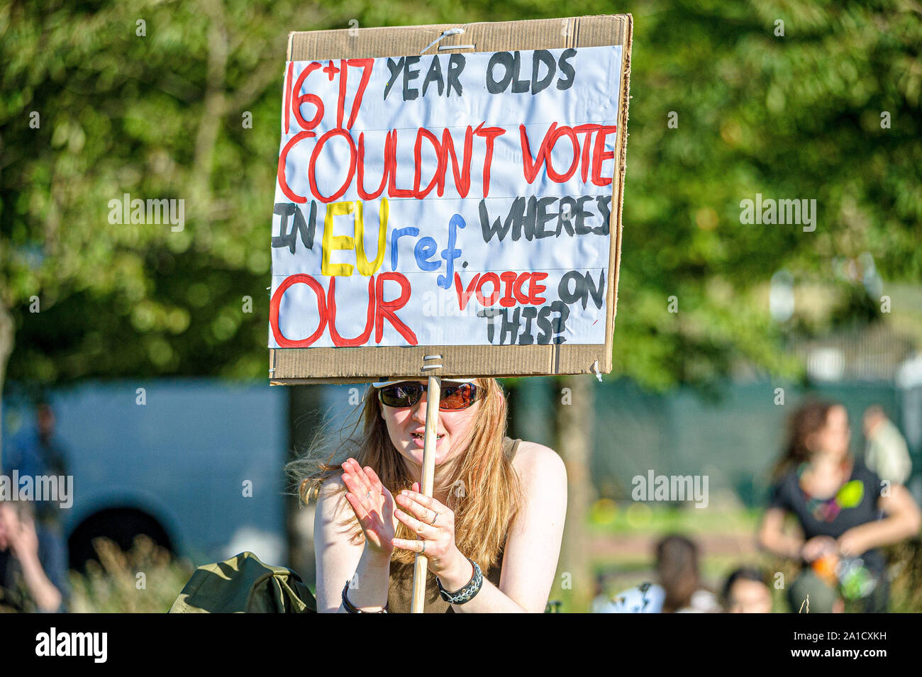 A protester holds a placard during the demonstration outside Scottish Parliament.Organized by European Movement in Scotland as well as Edinburgh For Europe, protesters took to the streets of Edinburgh to demand MPs revoke Article 50 to prevent a no-deal and that the EU shares a notion to combat climate change. Stock Photo