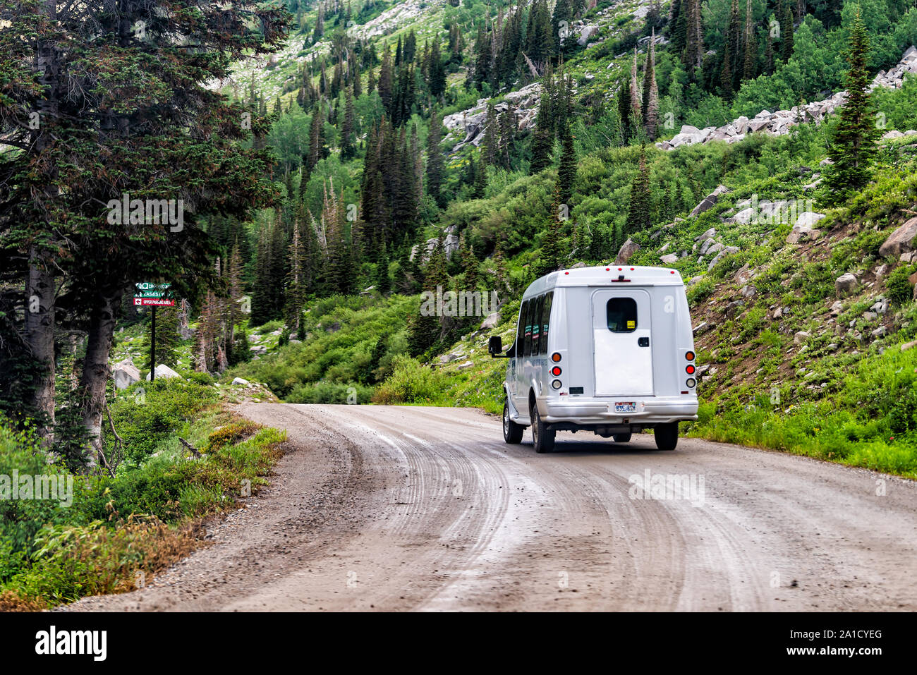 Alta, USA - July 27, 2019: Albion Basin, Utah summer with shuttle bus on dirt road in summer in Wasatch mountains Stock Photo