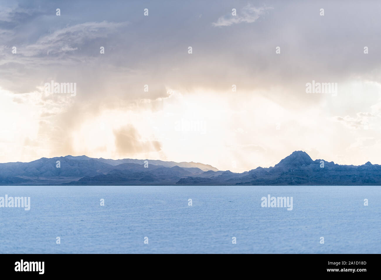 Bonneville Salt Flats and storm clouds near Salt Lake City, Utah and mountain view during sunset with nobody Stock Photo