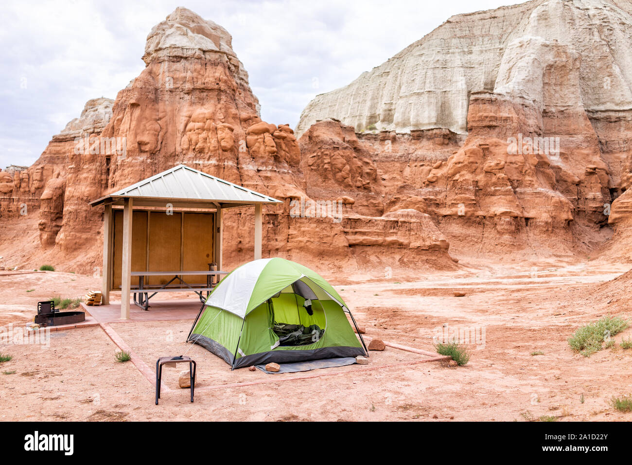 White and red layers of hoodoo sandstone rock formations view with tent and camp site in campground in desert landscape in Goblin Valley State Park Stock Photo Alamy