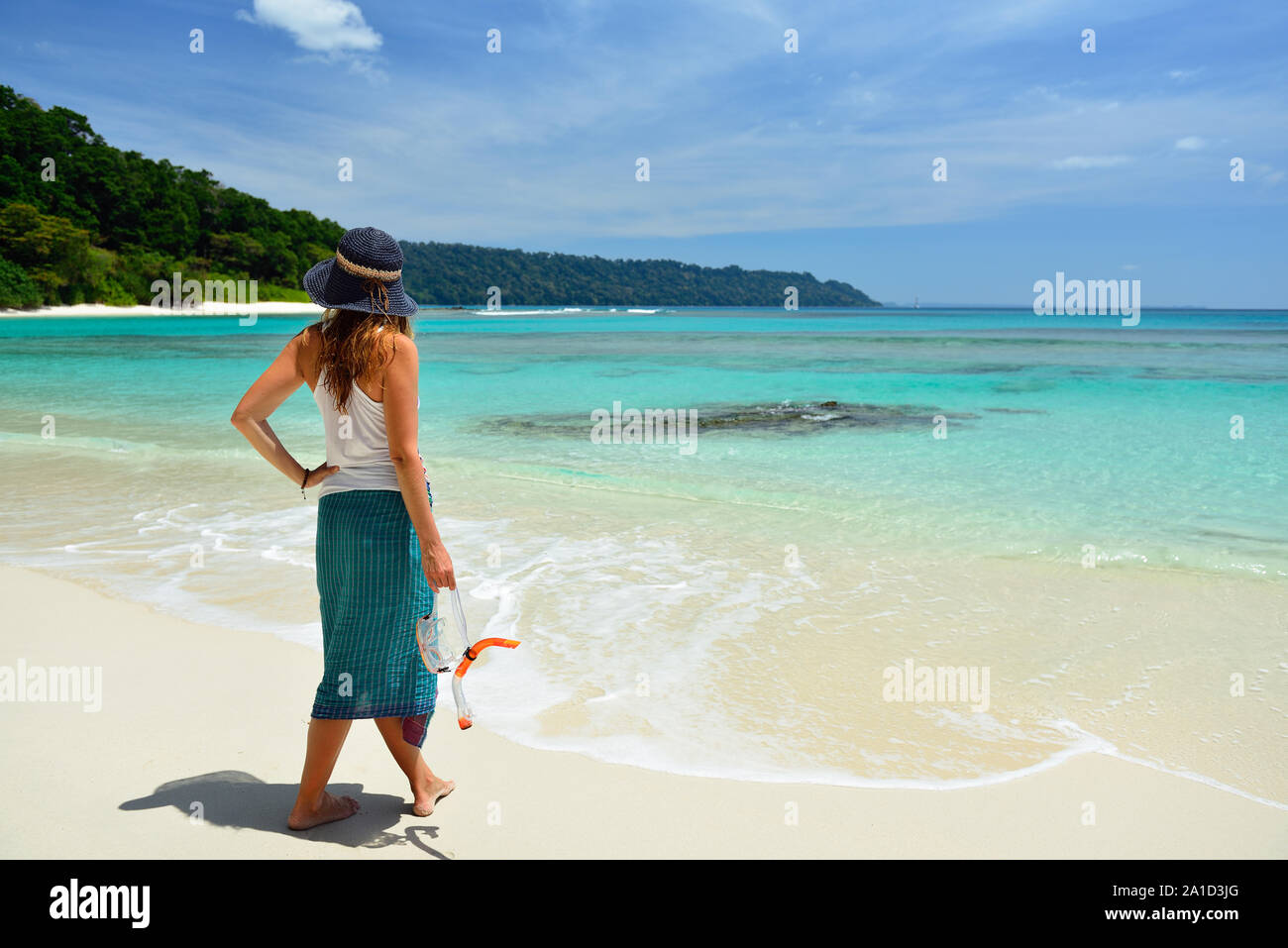 Tourist with diving equipment on the beach nr 7 at Havelock Island, Andaman and Nicobar Islands, India Stock Photo