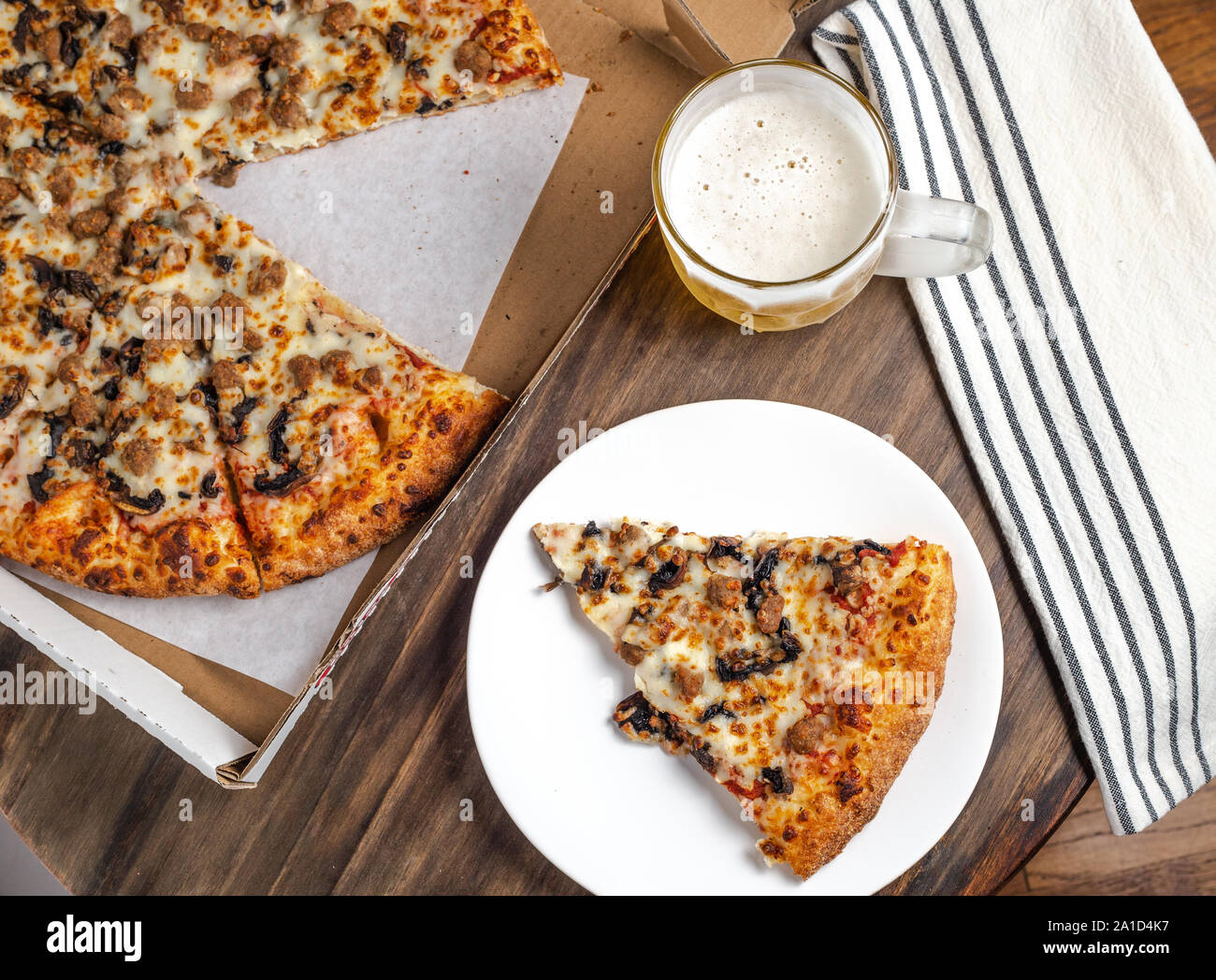 Tasty meal with pizza and beer Stock Photo