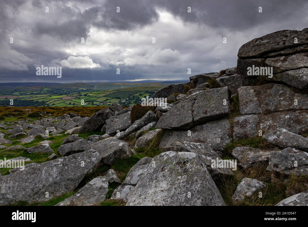 Storm clouds over granite tor on Dartmoor, Devon, England Stock Photo
