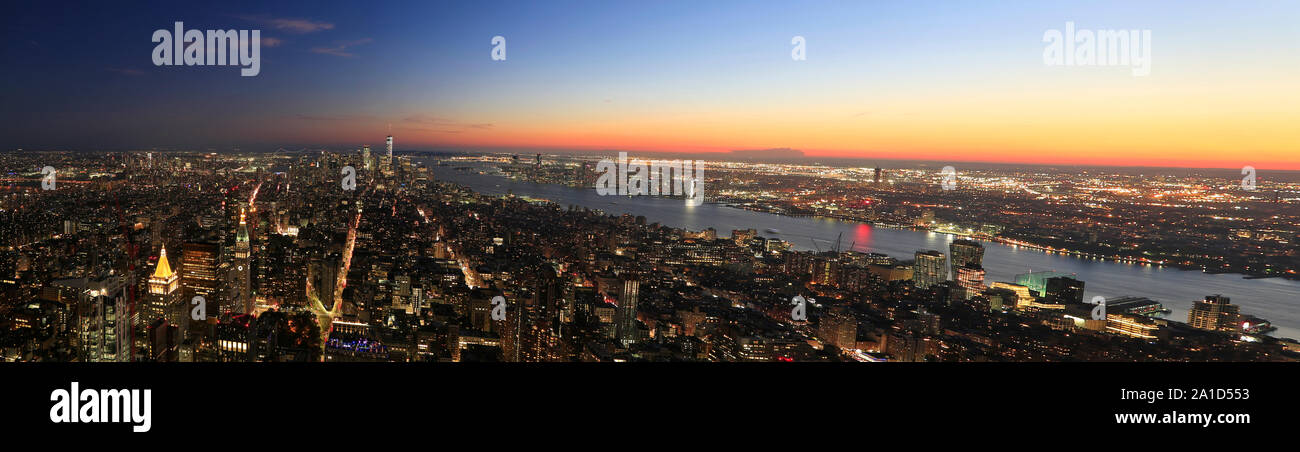 PanoramicaAerial view of New York City, Lower Manhattan skyline illuminated at sunset, USA Stock Photo