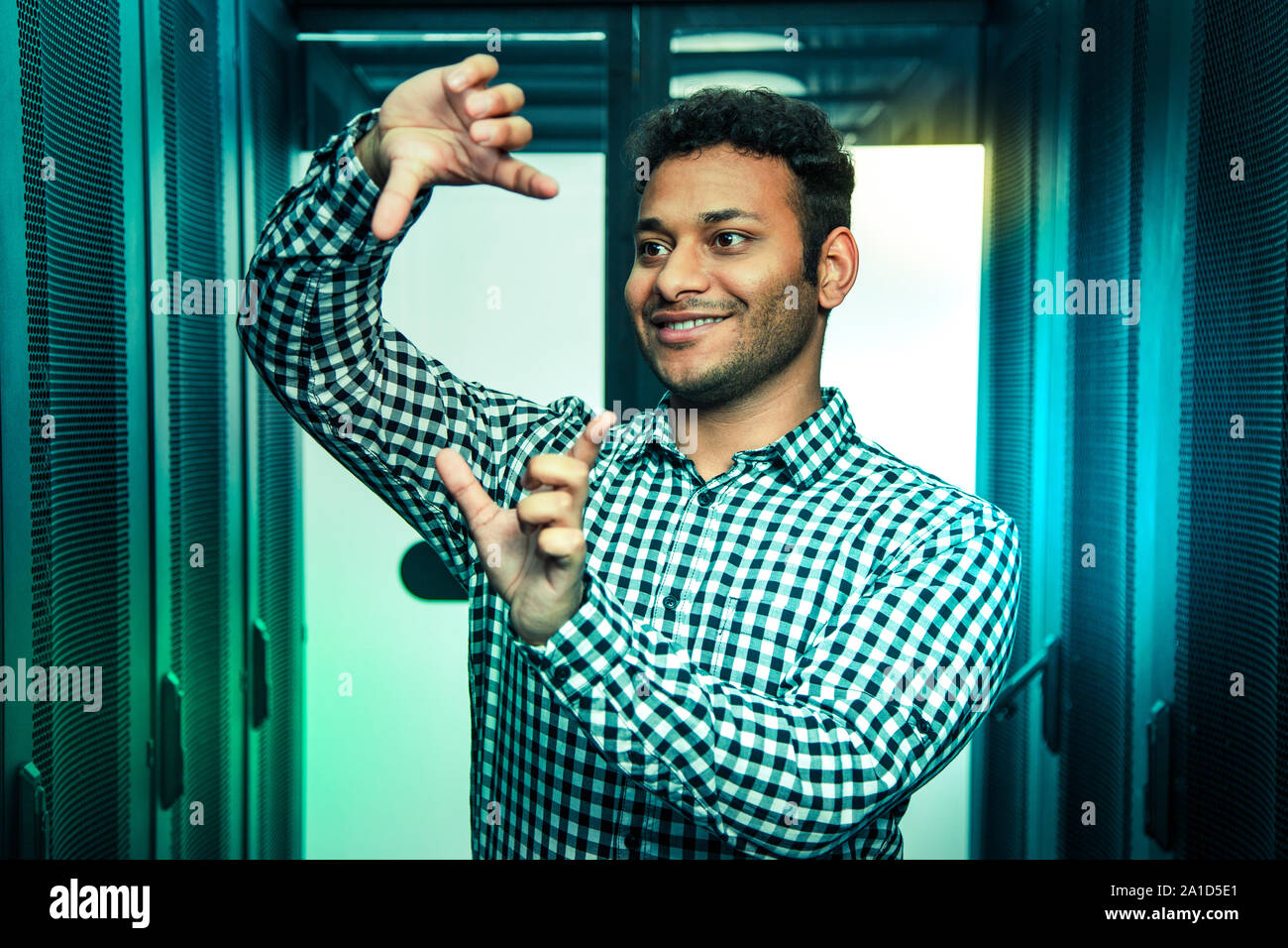 Delighted positive man using a virtual technology Stock Photo