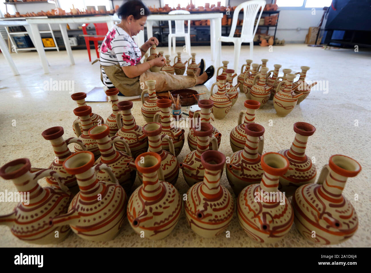 Beirut. 25th Sep, 2019. A worker colors potteries at a workshop in southern Lebanon, Sept. 25, 2019. Credit: Bilal Jawich/Xinhua Stock Photo