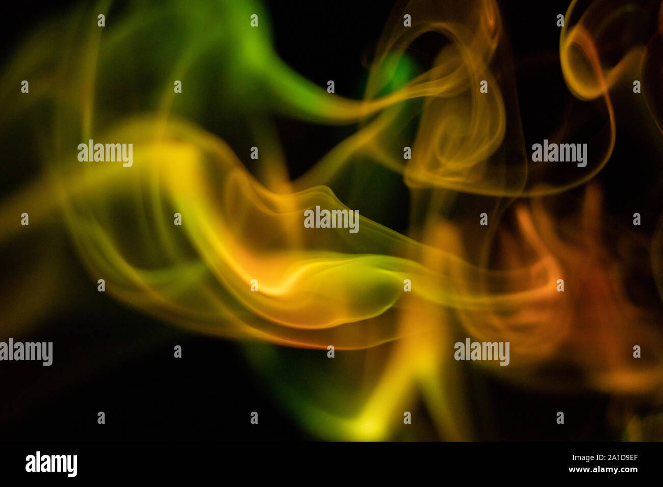 Yellow smoke on black background Stock Photo Alamy