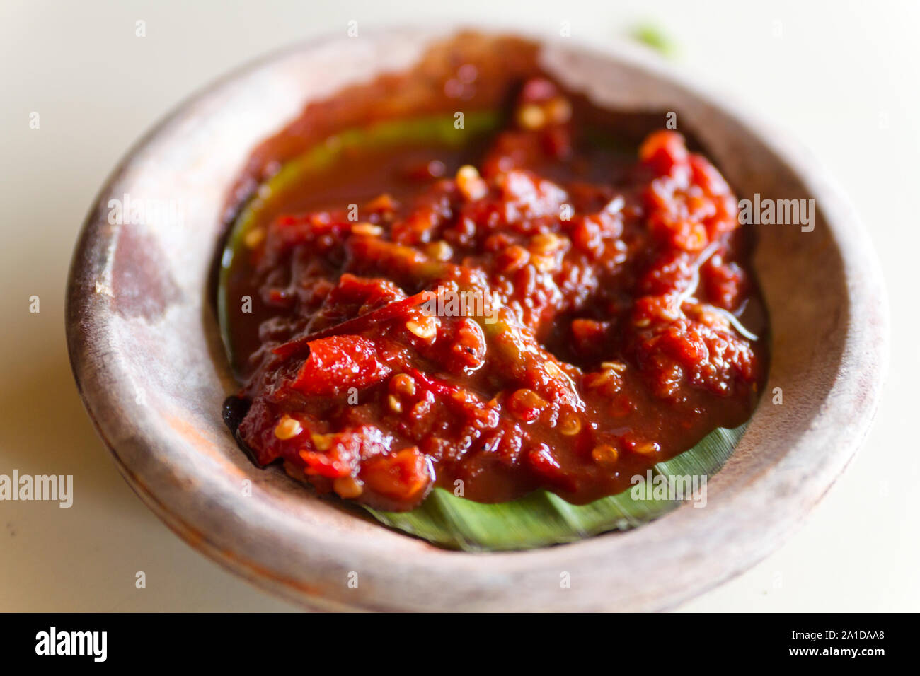 Chilli paste or sambal made from fresh red chilli served on banana leaf