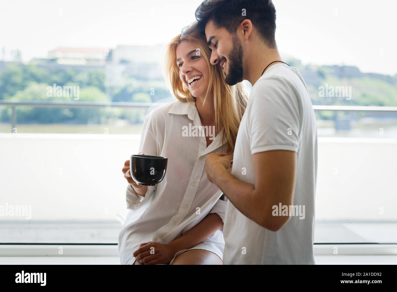 Couple enjoying a morning coffee Stock Photo - Alamy