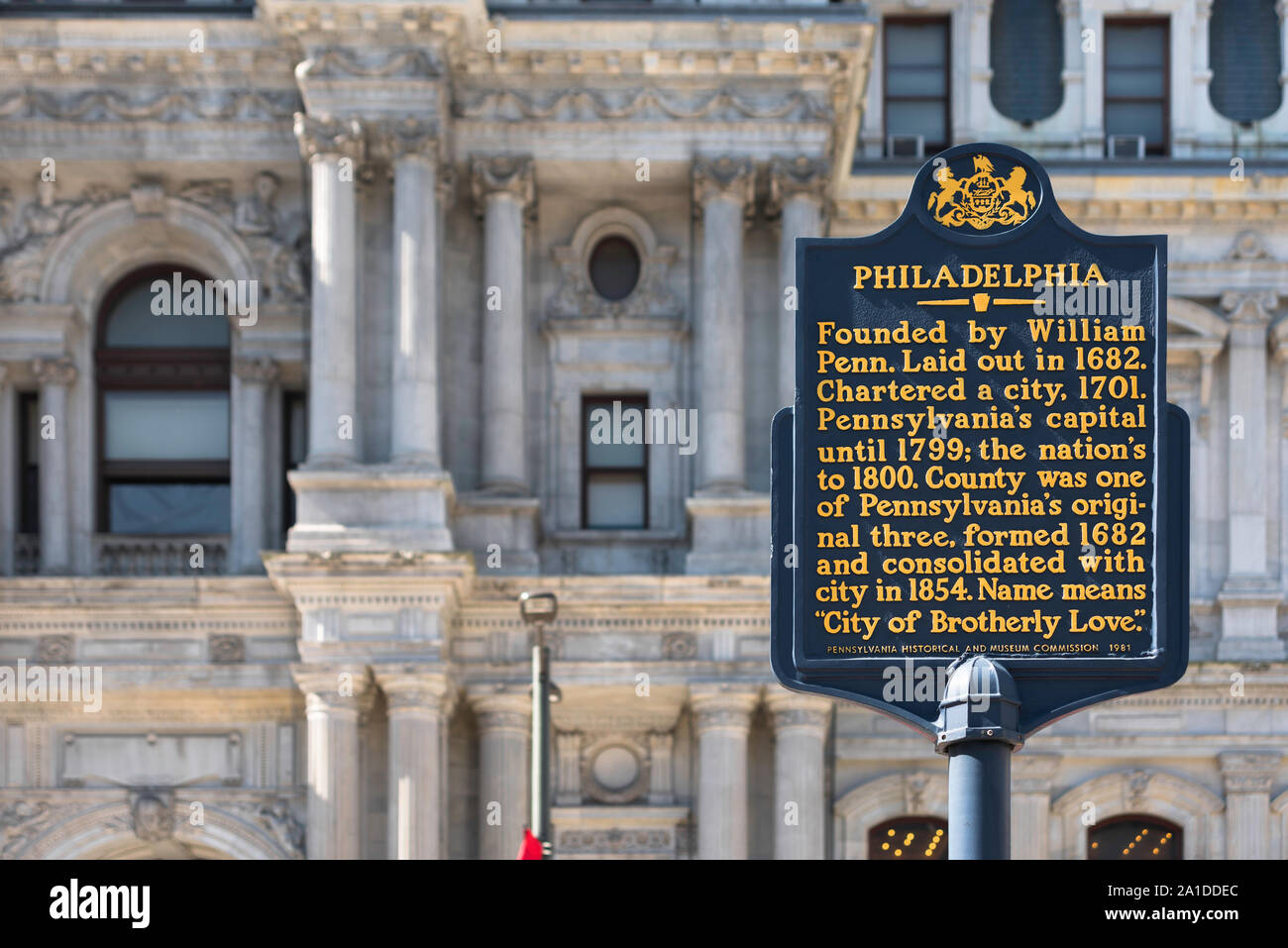 Philadelphia USA city, a sign in Penn Square detailing the historical development of Philadelphia with City Hall in the background, Pennsylvania, USA Stock Photo