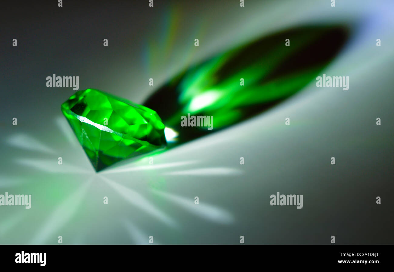 Multicolored glass crystal, diamond shape in rays Stock Photo Alamy