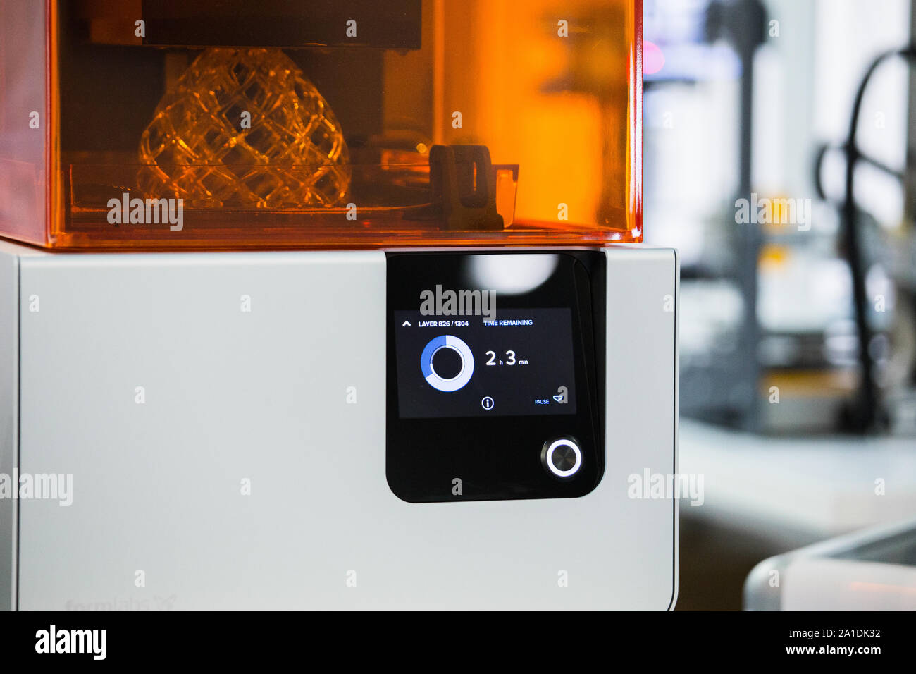 A stereolithography 3d printer in the laboratory prints a structure from a photopolymer. Stock Photo