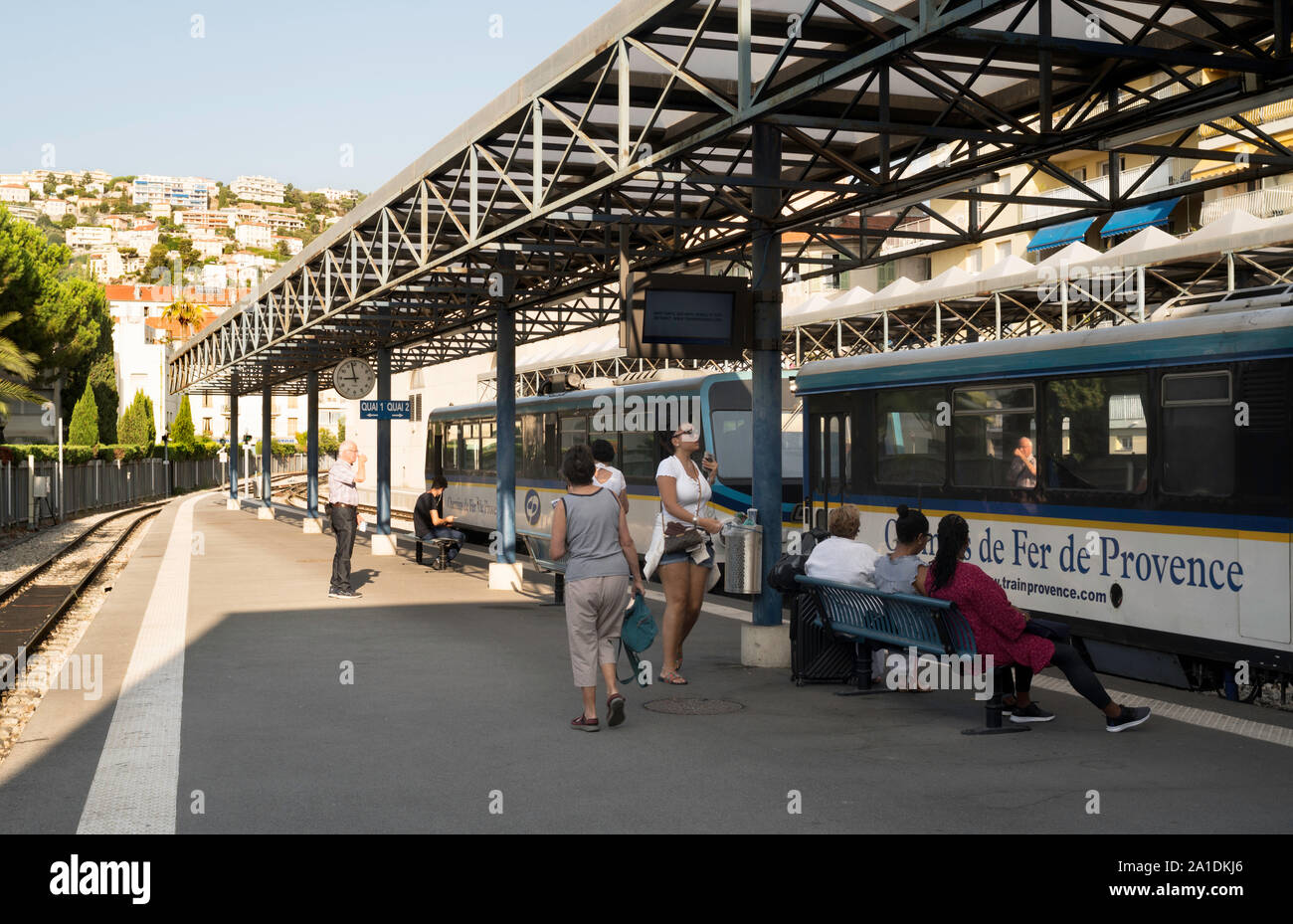 Passengers waiting for a train in the Chemins de Fer de Provence railway station, Nice, France, Europe Stock Photo