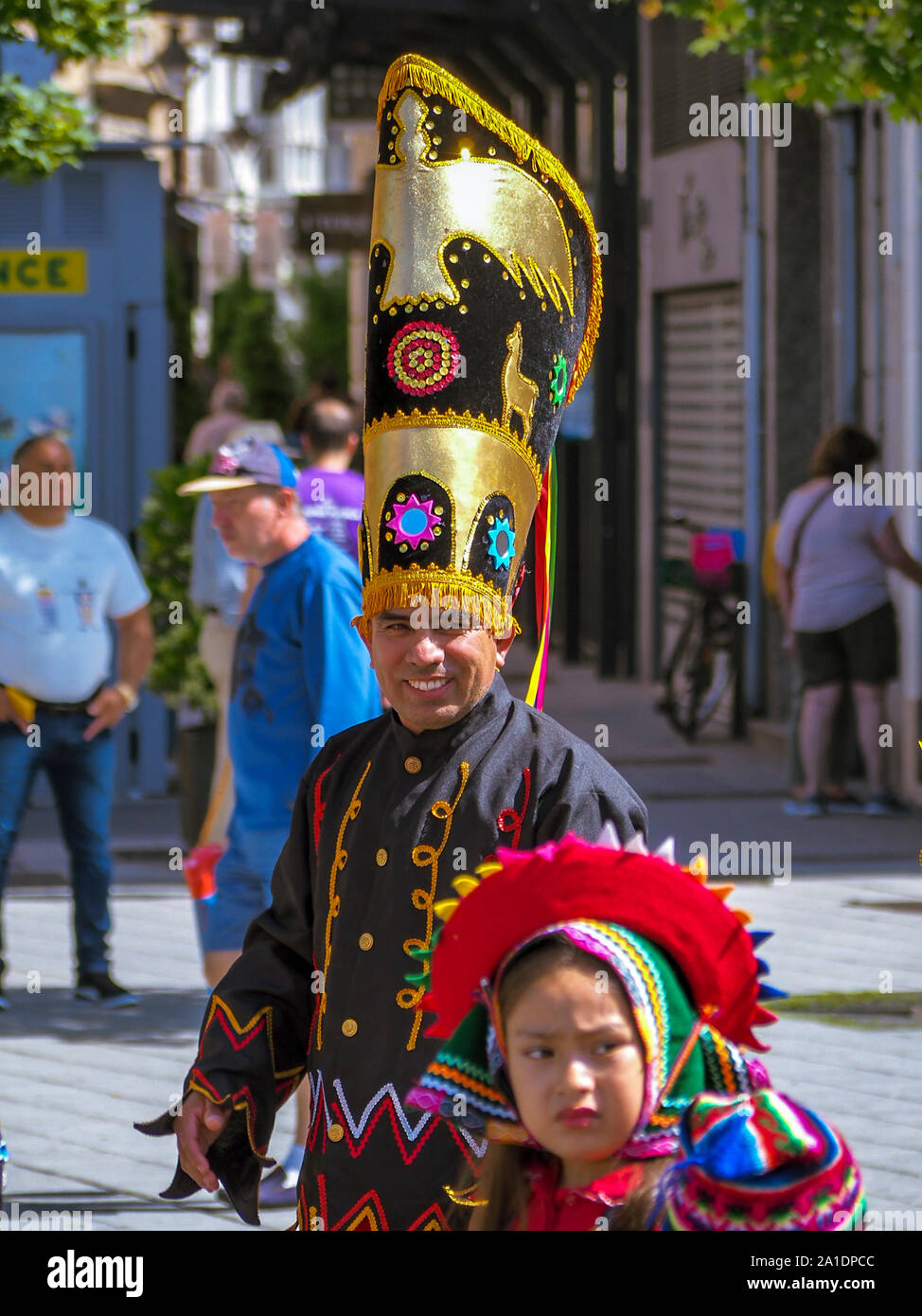 Man and girl wear their traditional costumes during the XV Intercultural Week Parade in Valladolid Stock Photo