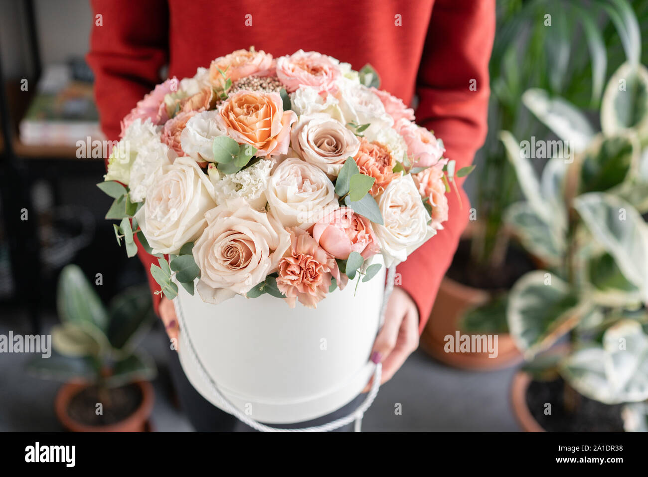 Cute Floral Arrangement Of Mixed Flowers In Woman Hand Round Box The Work Of The Florist At A Flower Shop Delicate Pastel Color Fresh Cut Flower Stock Photo Alamy