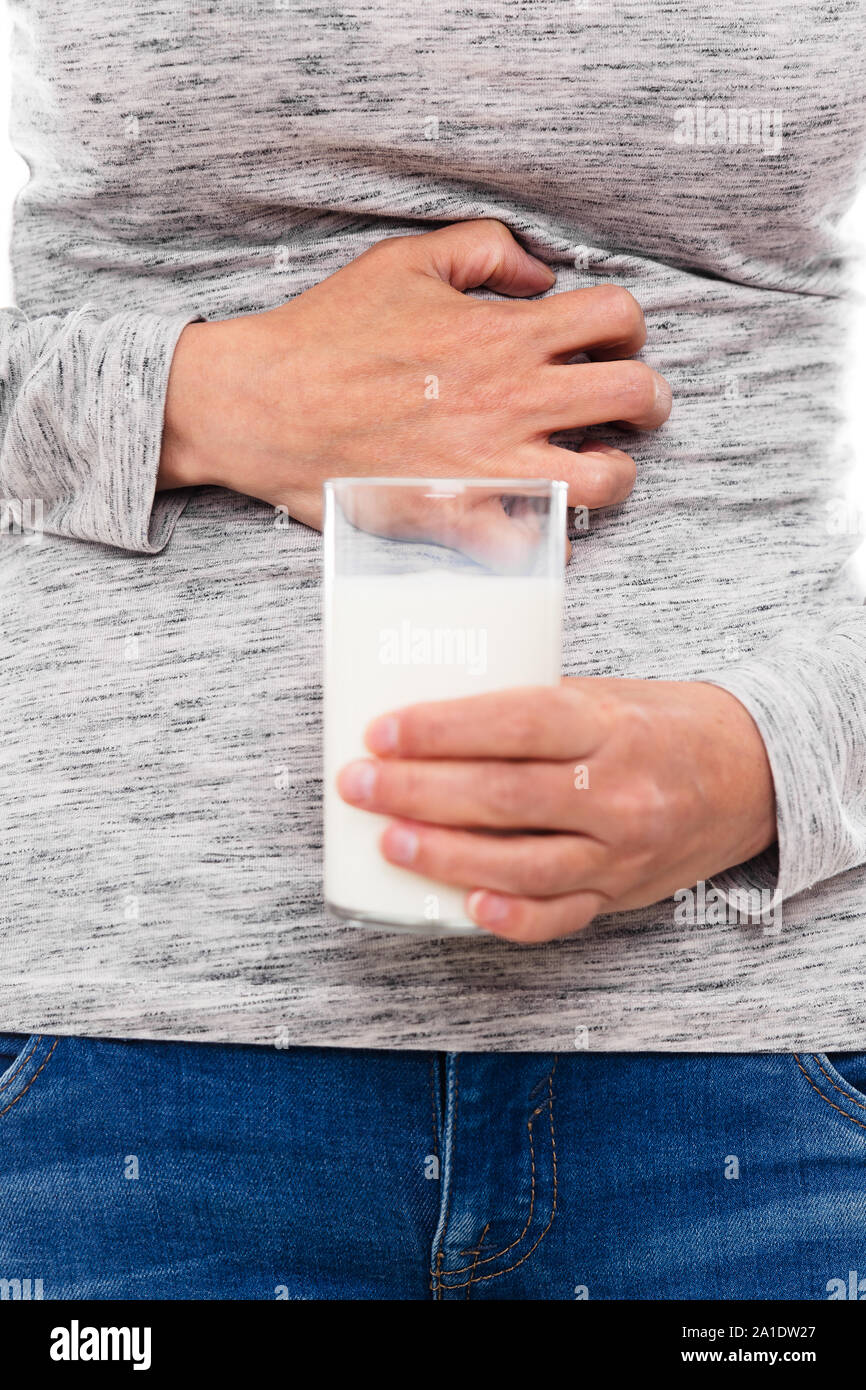 woman with milk allergy or lactose intolerance is having cramps Stock Photo