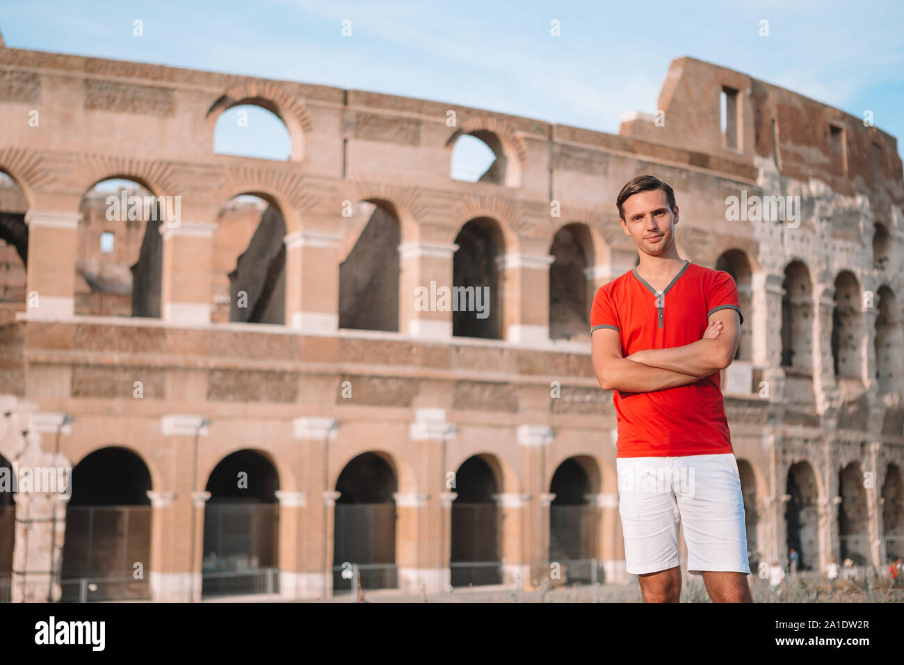 Happy man in Europe in Rome over Coliseum background. Italian european ...