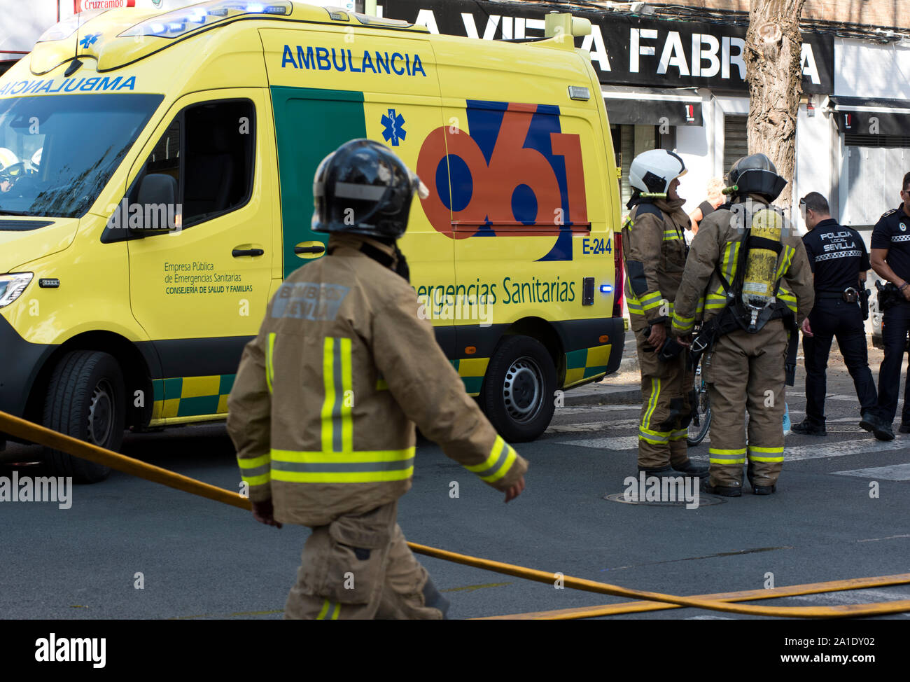 Spanish emergency services, firefighters, police and ambulances respond to an apartment fire in Seville, capital of Andalusia, Spain. Stock Photo
