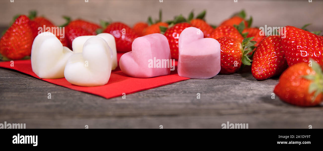 Strawberries and frozen yogurt, Froyo Bites in a heart shape, panorama Stock Photo