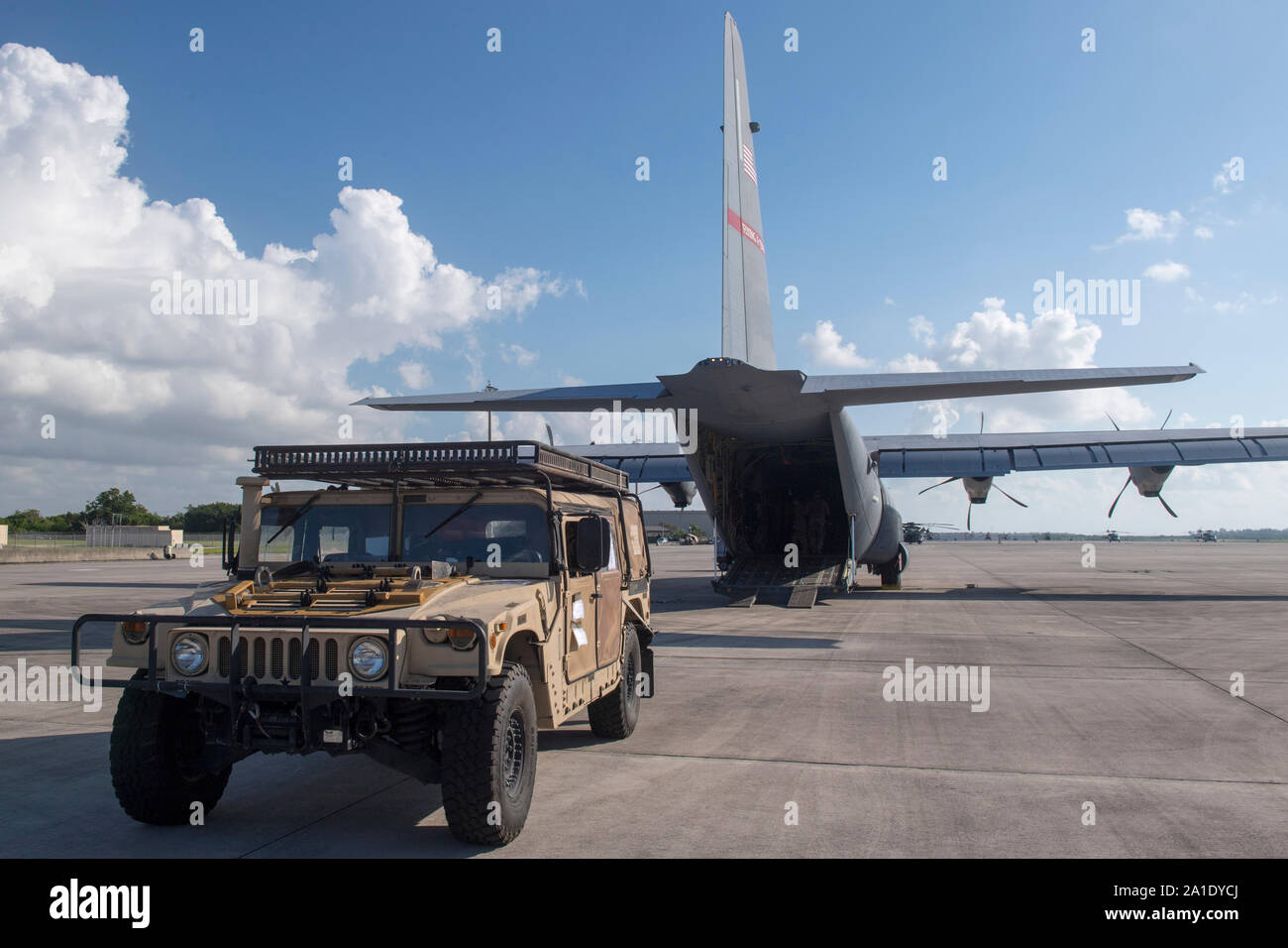 A U.S. Air Force Humvee is prepped to be loaded onto a C-130J Super Hercules, at Homestead Air Reserve Base, Fla., Sept. 11, 2019, to support a site survey mission in The Bahamas. U.S. Northern Command provided military-unique capabilities to the U.S. Agency for International Development, enabling the broader relief efforts addressing the acute humanitarian needs of the Bahamian people. (U.S. Air Force photo by Tech. Sgt. Joshua J. Garcia) Stock Photo