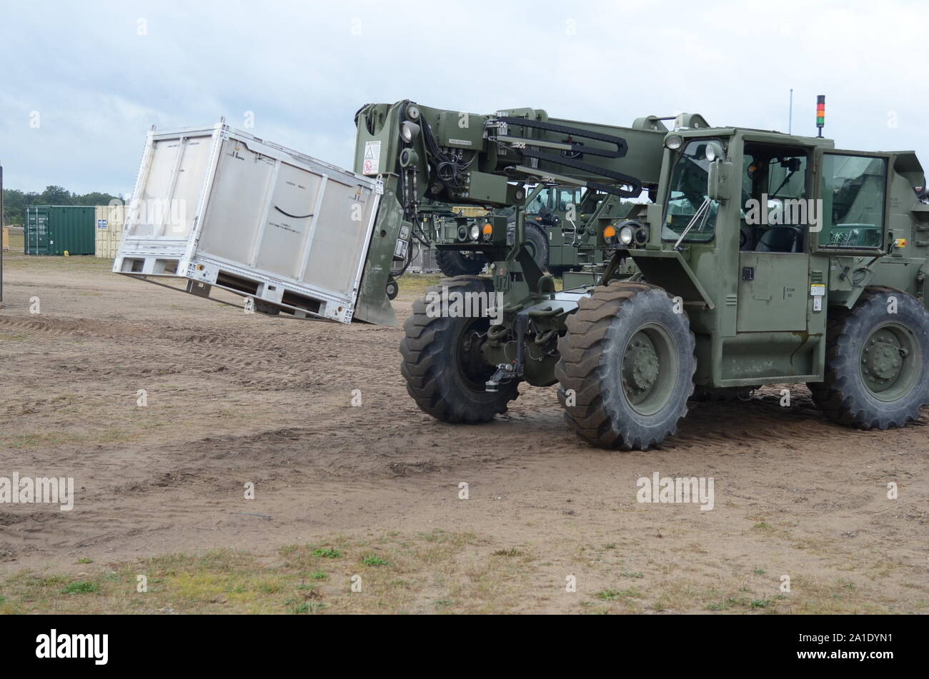 An unmanned forklift moves cargo around North FOB, Camp Grayling, Michigan, August 28, 2019.  Engineers, scientists, Soldiers and program managers from the U.S. Army Ground Vehicle Systems Center and the U.K.’s Defence Science and Technology Laboratory demonstrate the Coalition Autonomous Assured Resupply project, highlight the interoperability of the two nations’ armies with autonomous driving technology.  [U.S. Army photo by Jerome Aliotta//Released] Stock Photo
