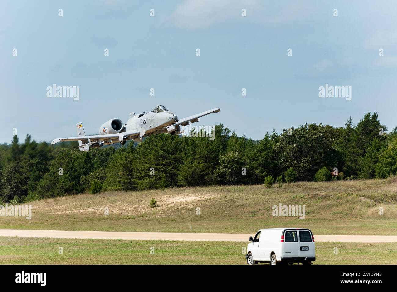 An A-10 Thunderbolt with the 104th Fighter Squadron of the Maryland Air National Guard at Baltimore practices landing approaches Sept. 10, 2019, at Young Air Assault Strip on South Post at Fort McCoy, Wis. The A-10 training was another unique type of training that has taken place at the airstrip in 2019. Wisconsin Guard members assisted with the training. (U.S. Army Photo by Russell Gamache, Fort McCoy Multimedia-Visual Information Office.) Stock Photo