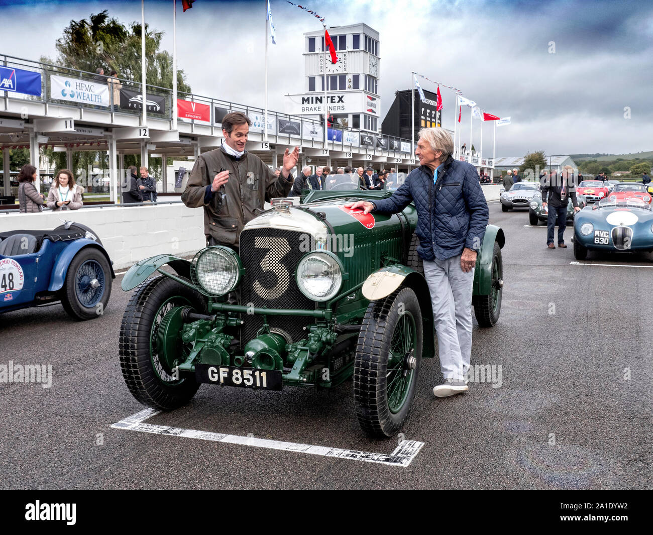 Ben Collins and Derek Bell with a Bentley Speed Six on the grid at the Veloce Charity Track day at Goodwood 25/9/19 Stock Photo