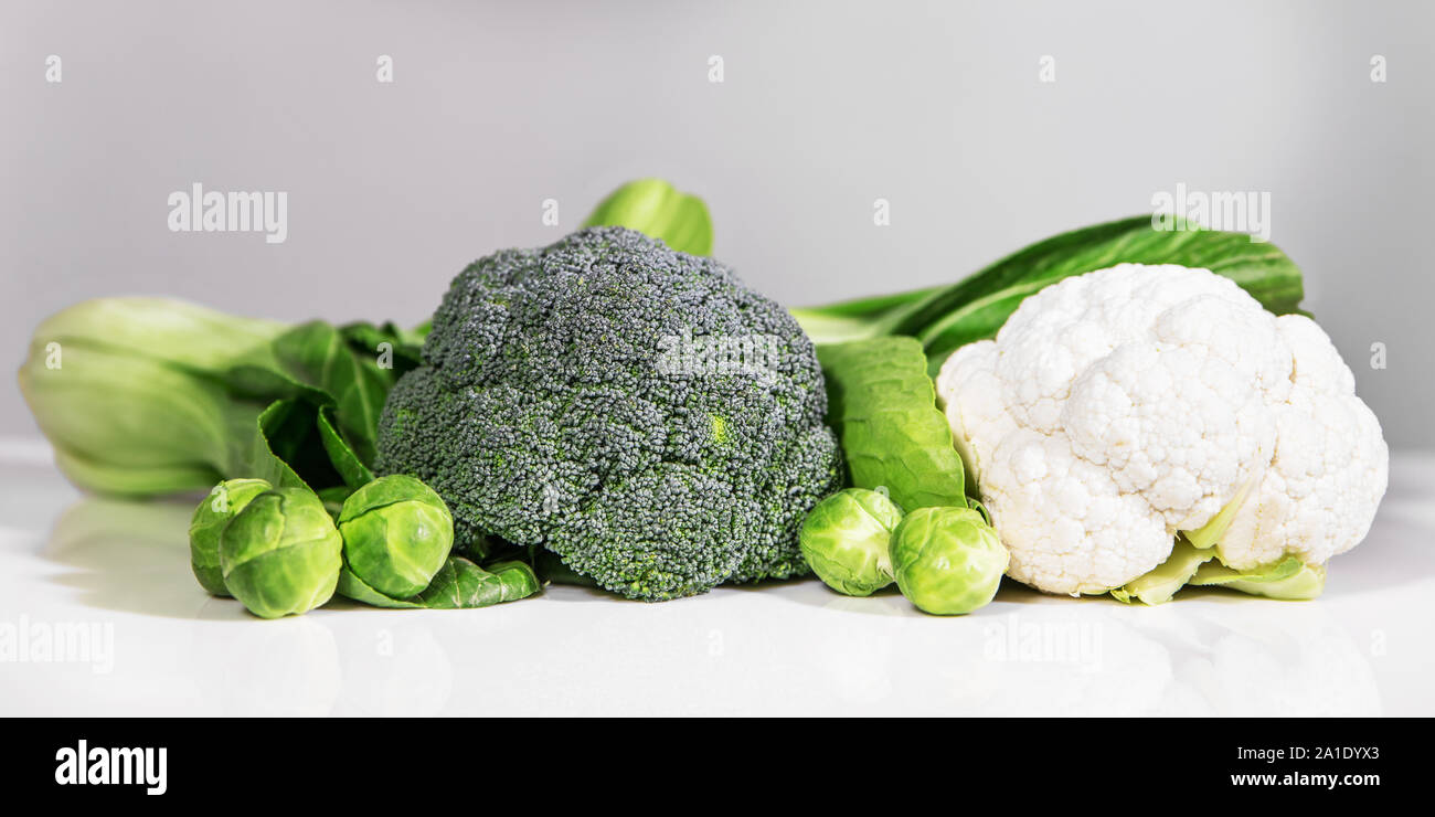 various vegetables in front of a white and grey background Stock Photo