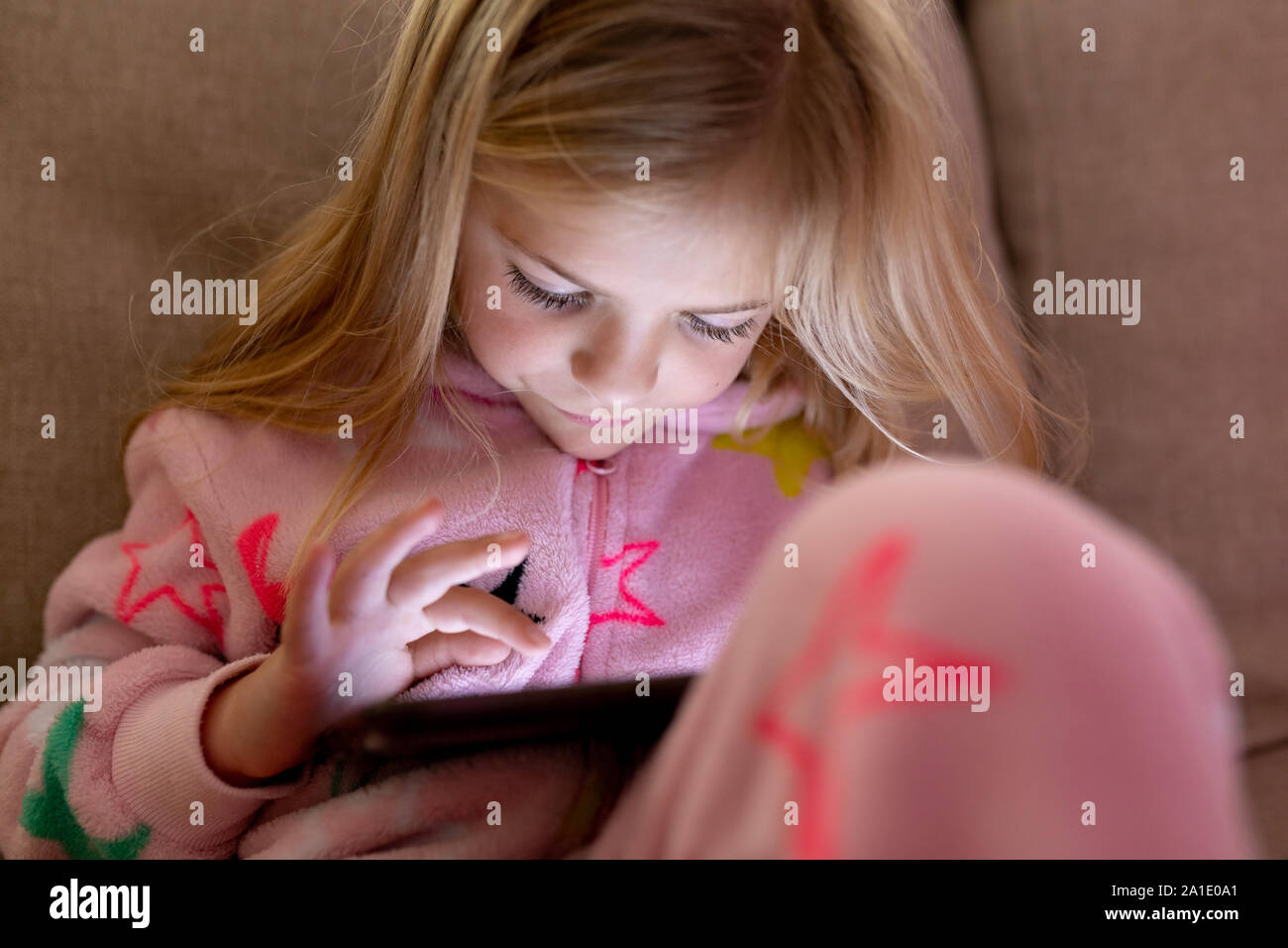 Girl using tablet at home Stock Photo