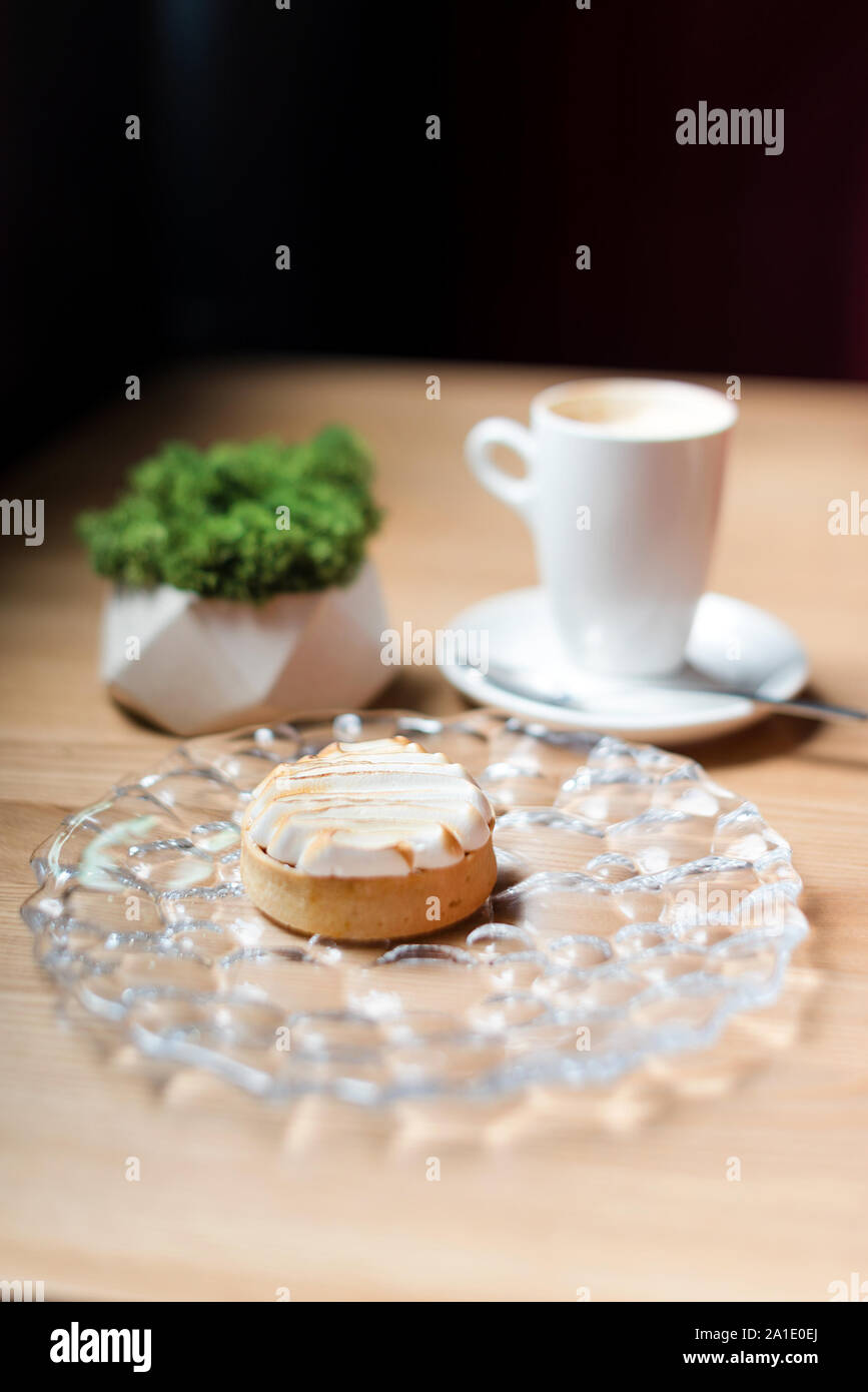 Cream tart with coffee. Dessert in cafe, selective focuse Stock Photo
