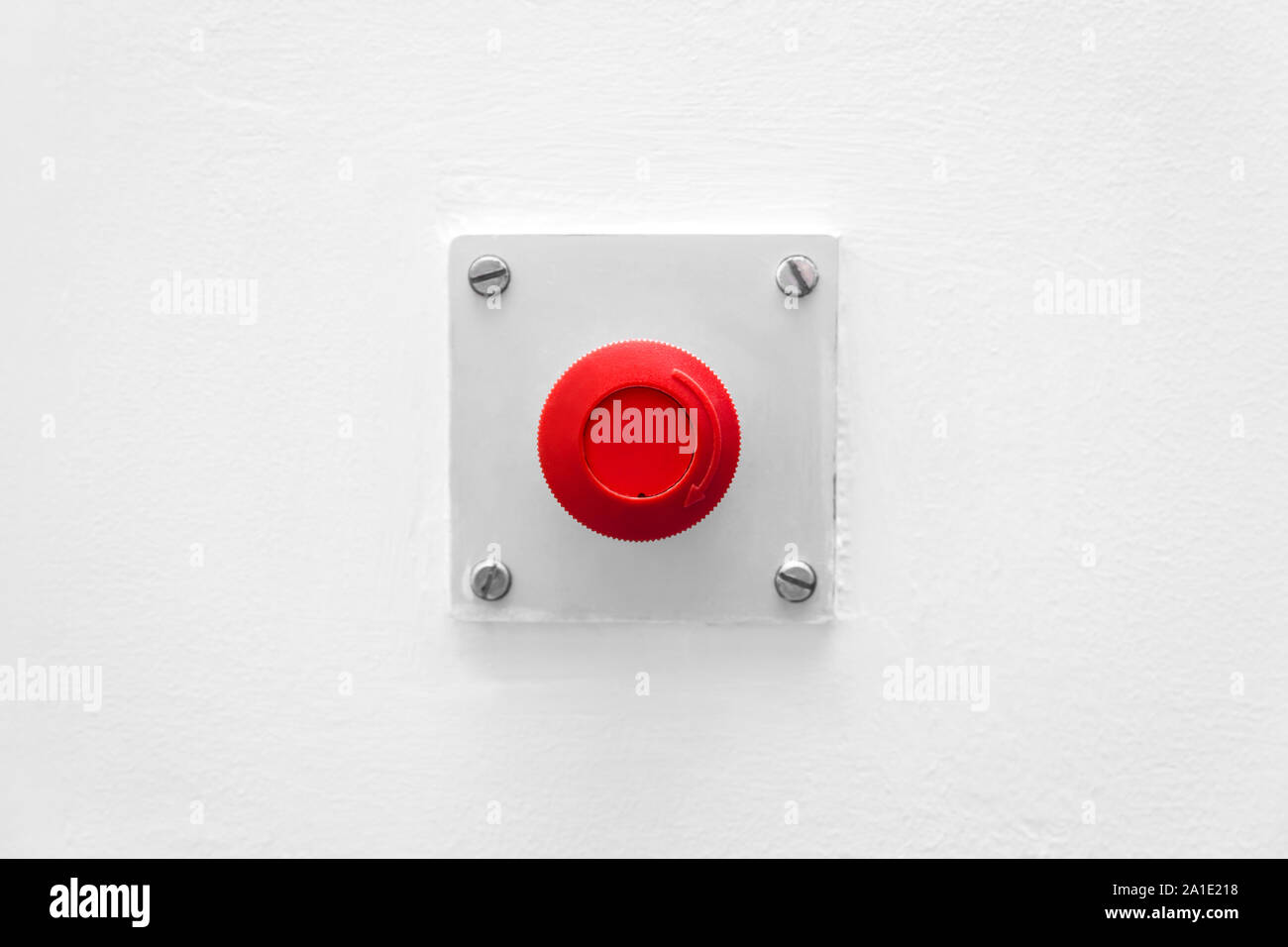 red emergency button on a white wall Stock Photo