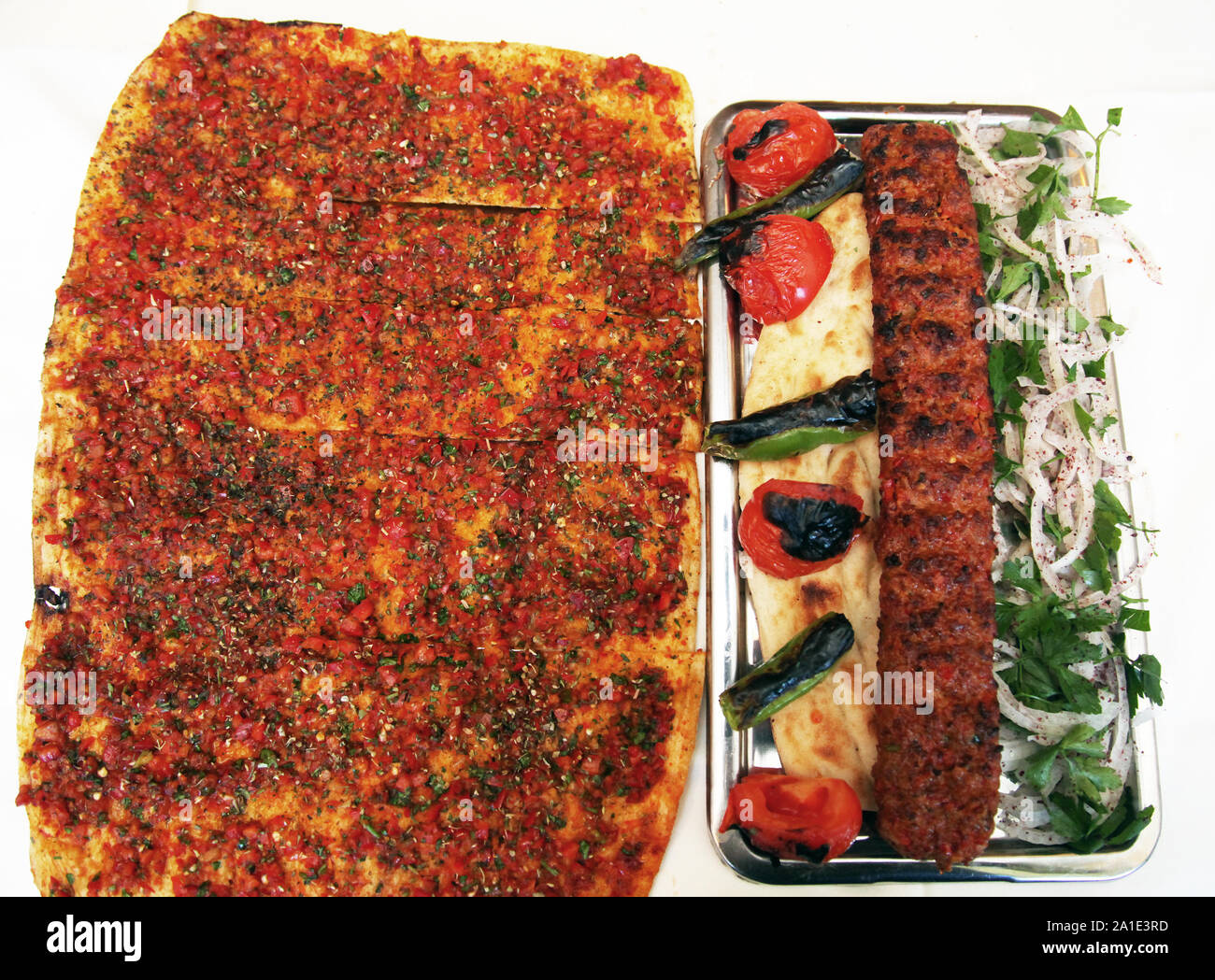 Turkish kebab with Turkish pizza (Lahmacun) on the restaurant table