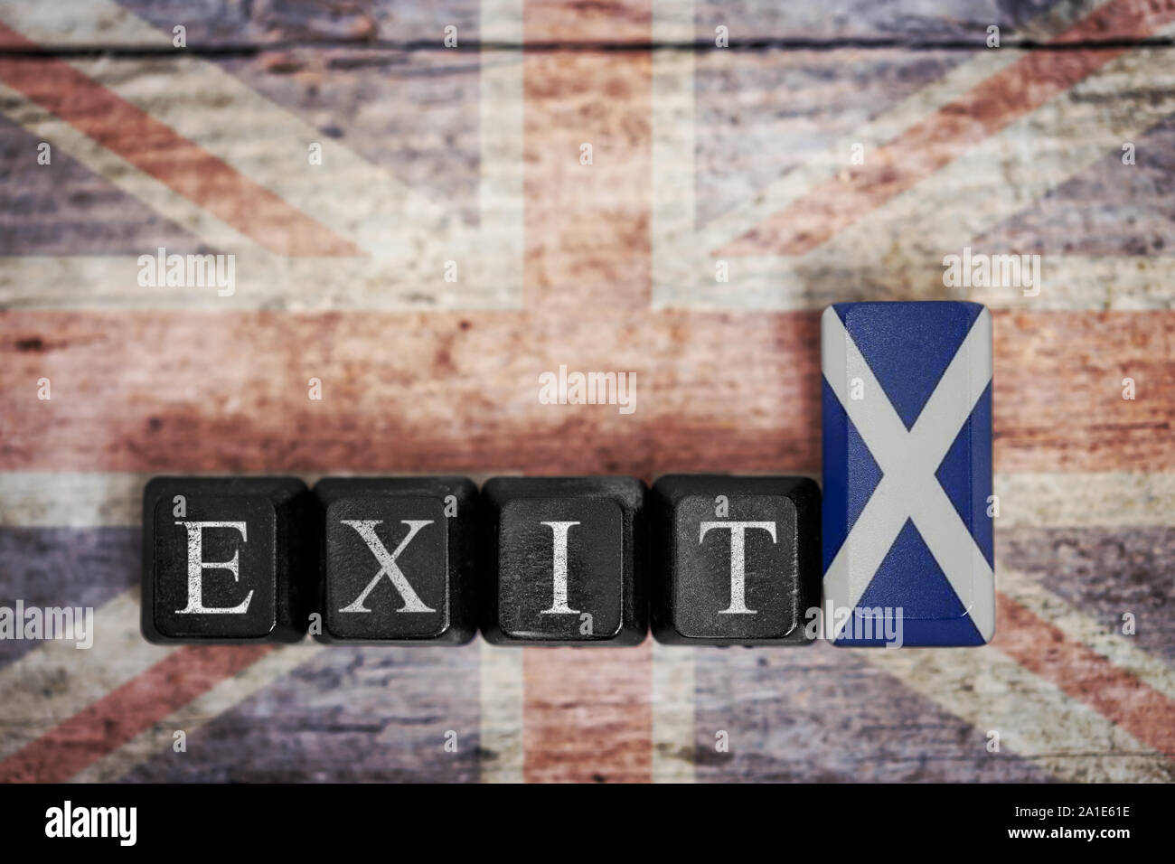 parts of a keyboard with flag of scotland and word exit, in front of uk flag, concept referendum and independence Stock Photo
