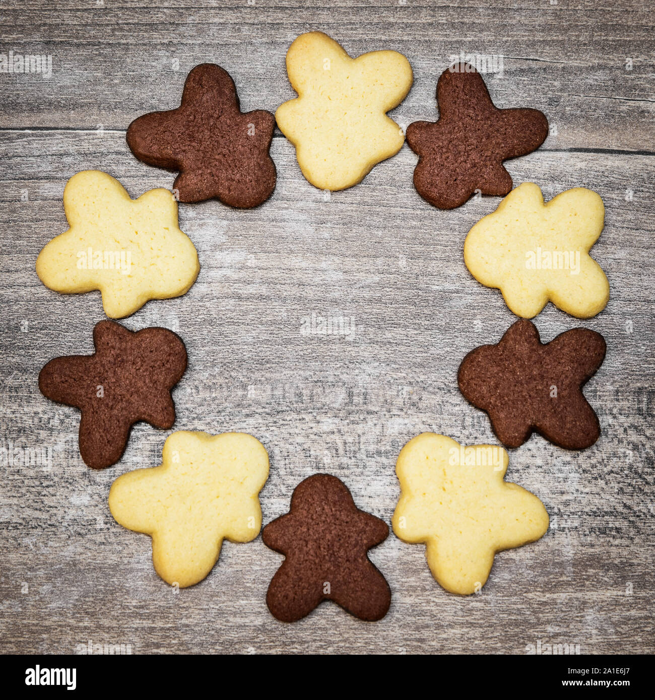 Brown and white human shape cookies in a circle, concept worldwide empathy and peace Stock Photo