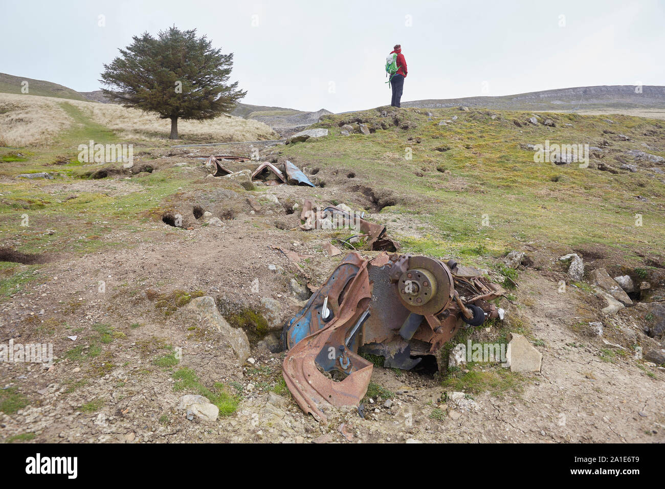 Abandoned remains of a vehicle and scrap metal near the old lead mines on Oxclose Road, Ivy Scar, between Woodhall and Carperby, Yorkshire Dales Natio Stock Photo